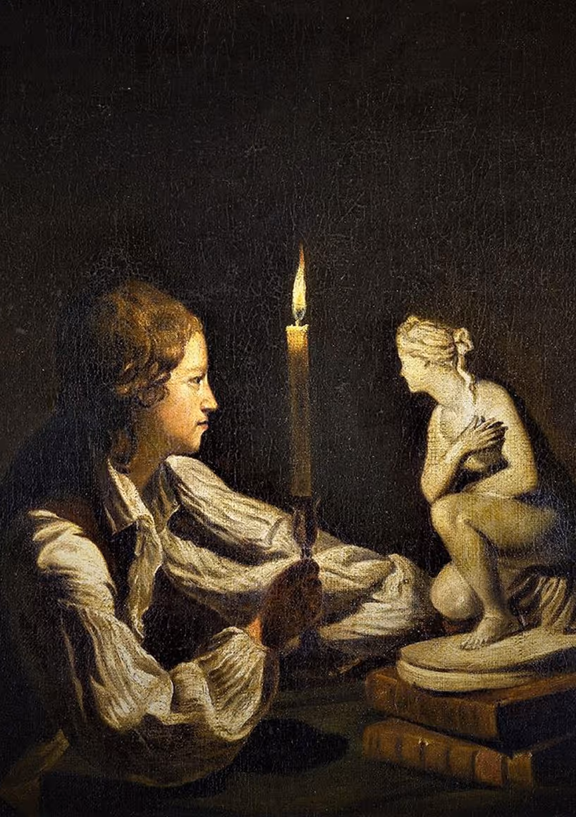 Classical painting of a young man holding a candle and gazing at a small sculpture illuminated by its light.